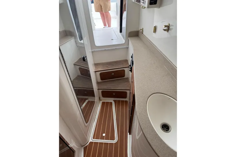  Yacht Photos Pics 2008 Contender 36 Fisharound cabin interior with wooden steps and countertop.