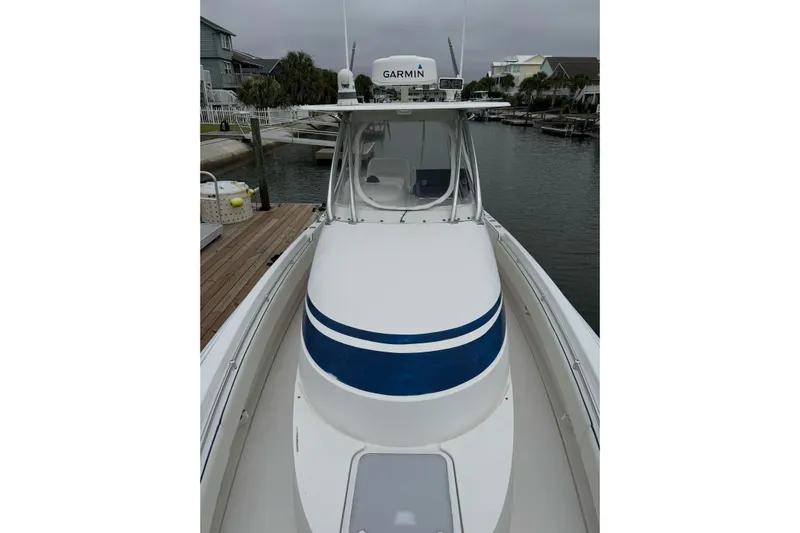  Yacht Photos Pics 2008 Contender 36 Fisharound boat docked, featuring Garmin equipment, sleek design, and spacious deck.