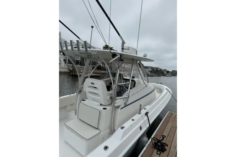  Yacht Photos Pics 2008 Contender 36 Fisharound boat docked, featuring sleek design and spacious seating.