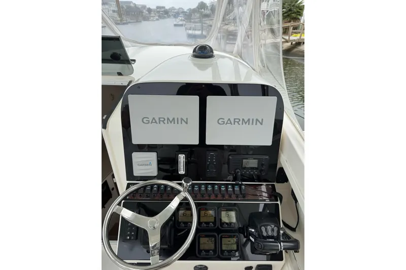  Yacht Photos Pics 2008 Contender 36 Fisharound helm with dual Garmin displays and navigation controls.