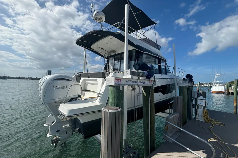 1095-953 Brokerage Josh Yacht Photos Pics 2024 Jeanneau NC Weekender 1095 Fly docked, featuring Yamaha outboard engines.