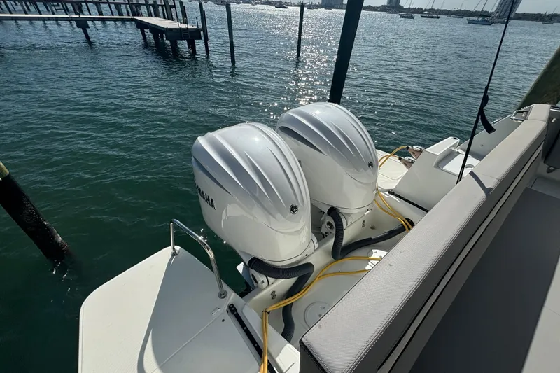 1095-953 Brokerage Josh Yacht Photos Pics 2024 Jeanneau NC Weekender 1095 Fly with dual Yamaha outboard engines on water.