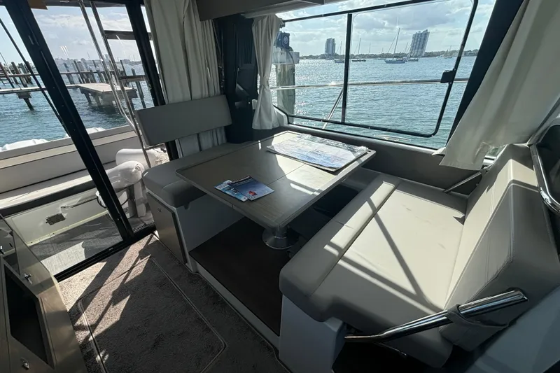 1095-953 Brokerage Josh Yacht Photos Pics Interior of 2024 Jeanneau NC Weekender 1095 Fly with waterfront view.
