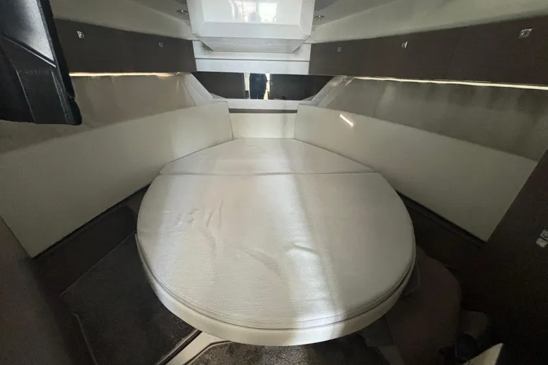 1095-953 Brokerage Josh Yacht Photos Pics 2024 Jeanneau NC Weekender 1095 Fly cabin interior with comfortable seating.