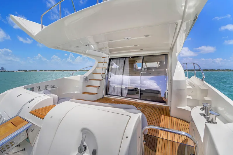 Bellami Too Yacht Photos Pics Luxurious 2008 Azimut 62E yacht deck with sleek design and ocean view.