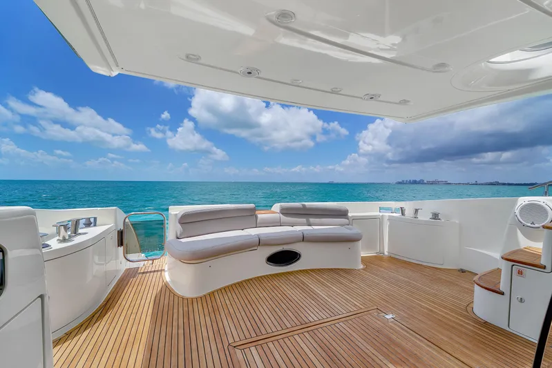 Bellami Too Yacht Photos Pics Luxurious 2008 Azimut 62E yacht deck with ocean view and comfortable seating.