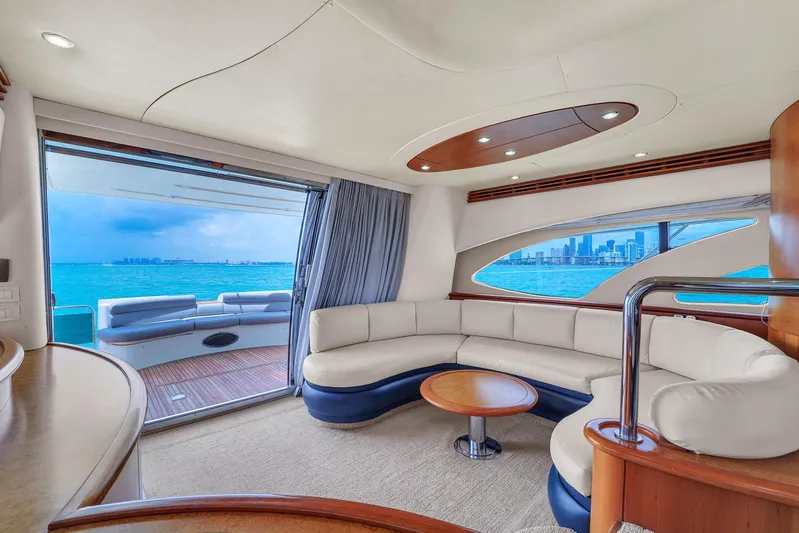 Bellami Too Yacht Photos Pics Luxurious interior of 2008 Azimut 62E yacht with ocean view and elegant seating area.