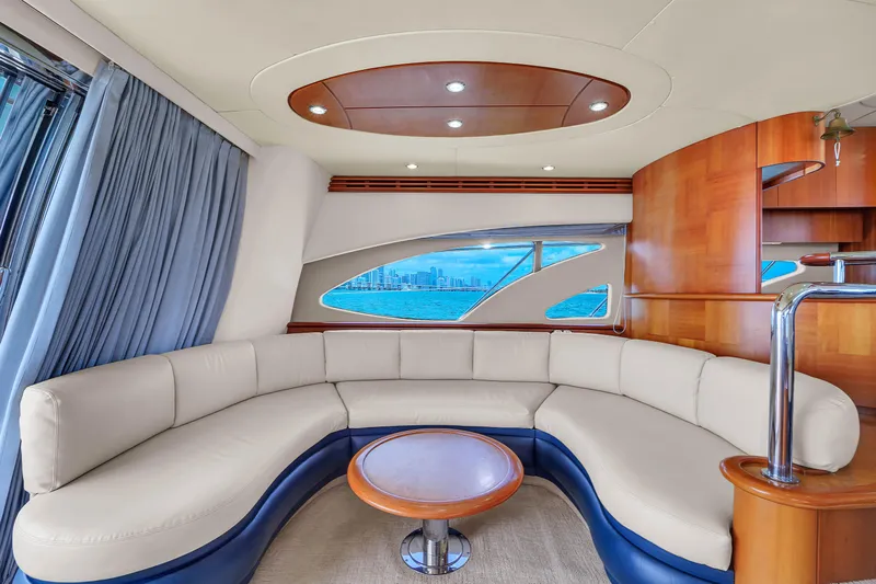 Bellami Too Yacht Photos Pics Luxurious interior of 2008 Azimut 62E yacht with elegant curved seating.
