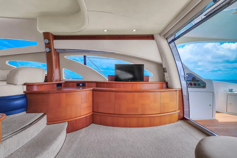 Bellami Too Yacht Photos Pics Luxurious interior of 2008 Azimut 62E yacht with elegant wood finish and ocean view.