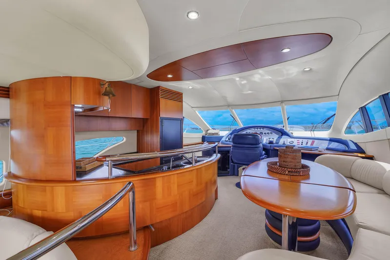 Bellami Too Yacht Photos Pics Luxurious interior of a 2008 Azimut 62E yacht with elegant wood finishes.