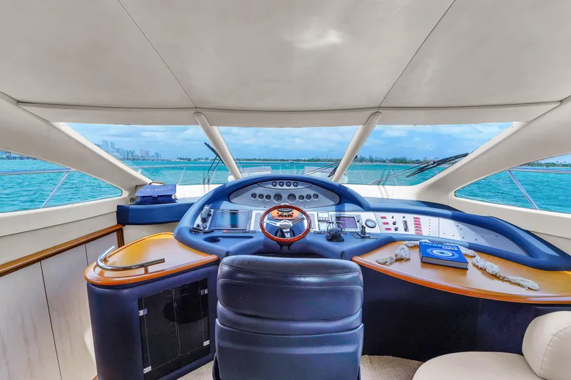 Bellami Too Yacht Photos Pics 2008 Azimut 62E yacht helm with panoramic ocean view and modern navigation controls.