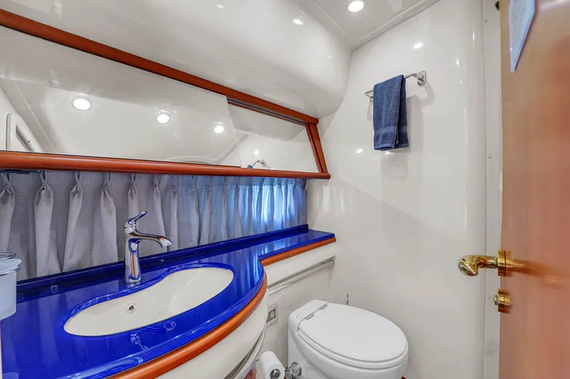 Bellami Too Yacht Photos Pics Luxurious bathroom in 2008 Azimut 62E yacht with blue countertop and modern fixtures.