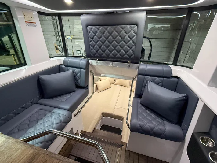 Tiny Dancer Yacht Photos Pics Luxurious interior of 2020 Axopar 37 XC boat with quilted seating and modern design.