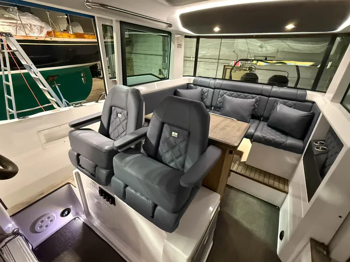 Tiny Dancer Yacht Photos Pics Luxurious interior of 2020 Axopar 37 XC boat with plush seating and modern design.