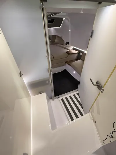 Tiny Dancer Yacht Photos Pics Interior of 2020 Axopar 37 XC boat, featuring modern seating and sleek design.