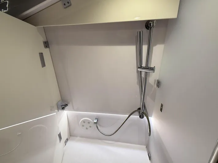 Tiny Dancer Yacht Photos Pics Shower area in 2020 Axopar 37 XC boat, featuring modern fixtures and sleek design.