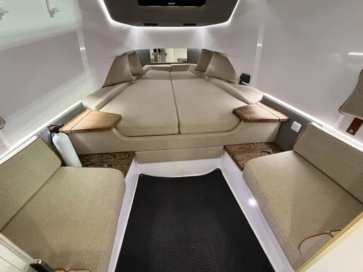 Tiny Dancer Yacht Photos Pics 2020 Axopar 37 XC cabin interior with beige seating and modern design.