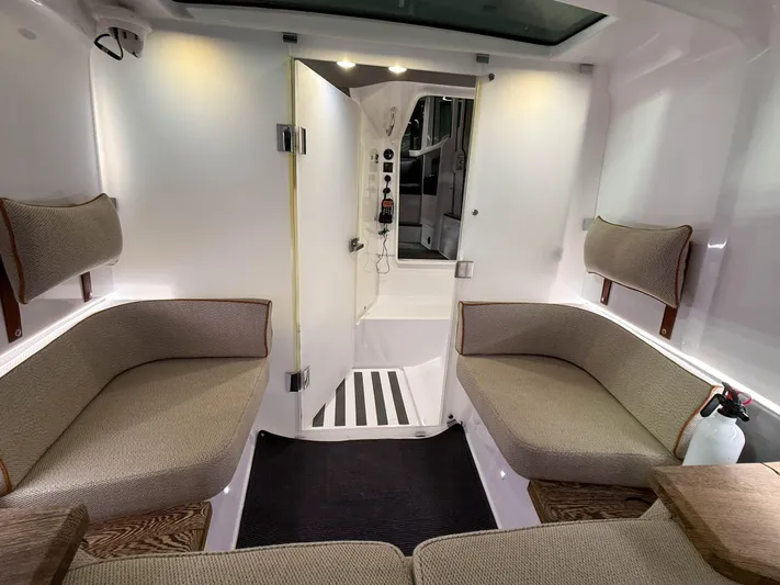 Tiny Dancer Yacht Photos Pics Interior of 2020 Axopar 37 XC boat with cozy seating and modern design.