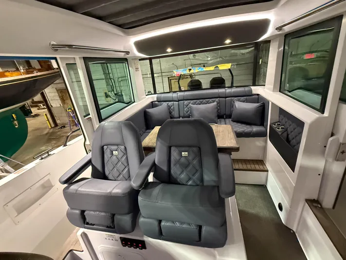 Tiny Dancer Yacht Photos Pics Interior of 2020 Axopar 37 XC boat with luxurious seating and modern design.