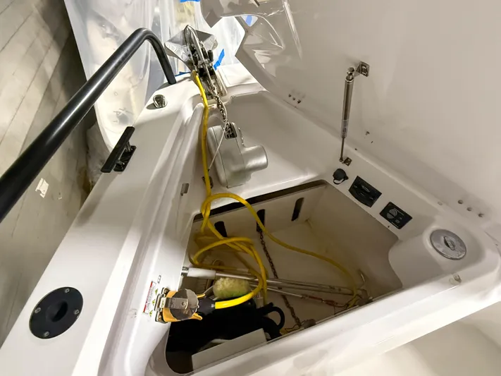Tiny Dancer Yacht Photos Pics Storage compartment of 2020 Axopar 37 XC boat with equipment and wiring.