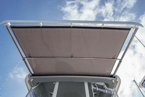 R&r 5 Yacht Photos Pics 2022 Intrepid 477 Evolution boat canopy against a blue sky.