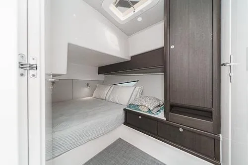 R&r 5 Yacht Photos Pics 2022 Intrepid 477 Evolution cabin interior with bed, storage, and modern design.