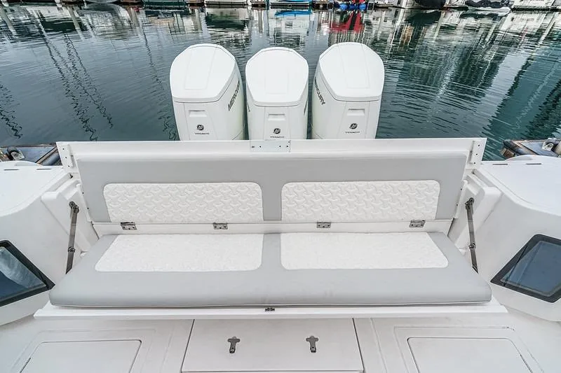 R&r 5 Yacht Photos Pics 2022 Intrepid 477 Evolution boat with triple Mercury engines and cushioned seating.