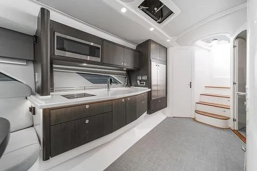 R&r 5 Yacht Photos Pics Luxurious interior of 2022 Intrepid 477 Evolution yacht with modern kitchen design.