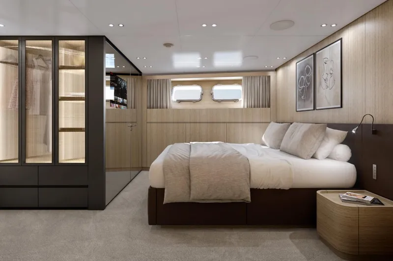  Yacht Photos Pics Luxurious 2024 Sanlorenzo SX100 yacht bedroom with modern design and elegant furnishings.