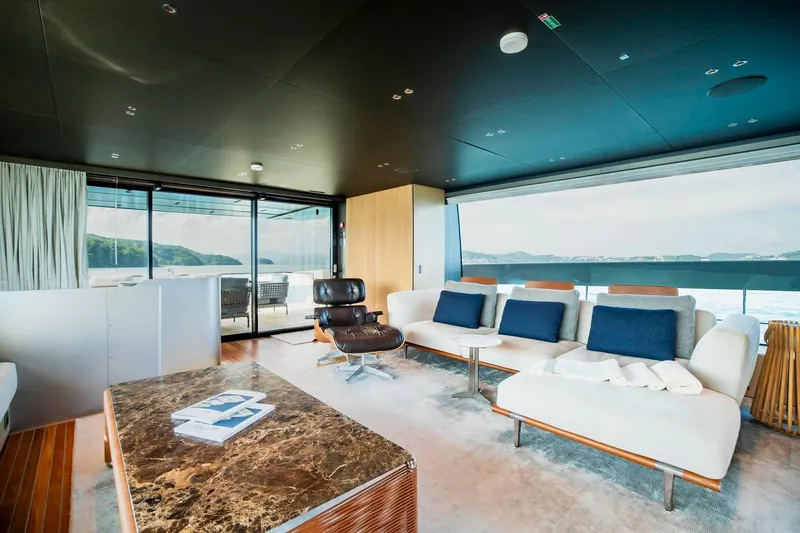  Yacht Photos Pics Luxurious interior of 2024 Sanlorenzo SX100 yacht with modern furnishings and ocean view.