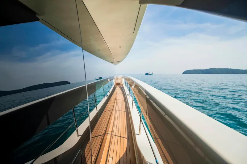  Yacht Photos Pics 2024 Sanlorenzo SX100 yacht deck with ocean view and distant islands.