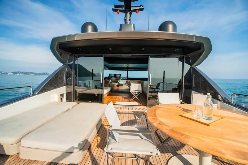  Yacht Photos Pics Luxurious 2024 Sanlorenzo SX100 yacht deck with seating and ocean view.