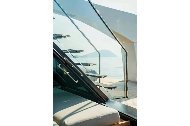  Yacht Photos Pics Modern staircase on 2024 Sanlorenzo SX100 yacht with ocean view.