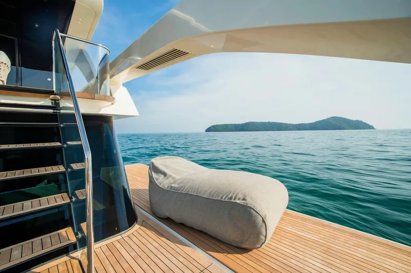  Yacht Photos Pics Luxurious 2024 Sanlorenzo SX100 yacht deck with ocean view and comfortable seating.