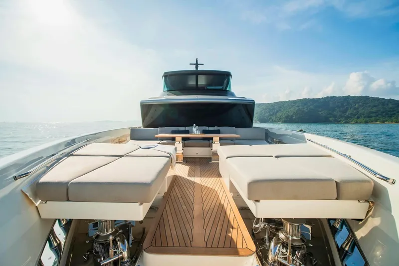  Yacht Photos Pics 2024 Sanlorenzo SX100 yacht deck with luxurious seating and scenic ocean view.