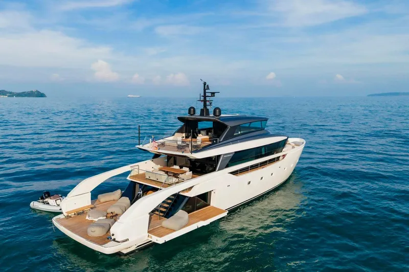  Yacht Photos Pics Luxurious 2024 Sanlorenzo SX100 yacht cruising on open sea under clear skies.