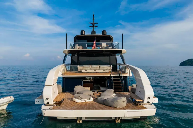  Yacht Photos Pics 2024 Sanlorenzo SX100 yacht on open sea, featuring spacious deck and luxurious seating.