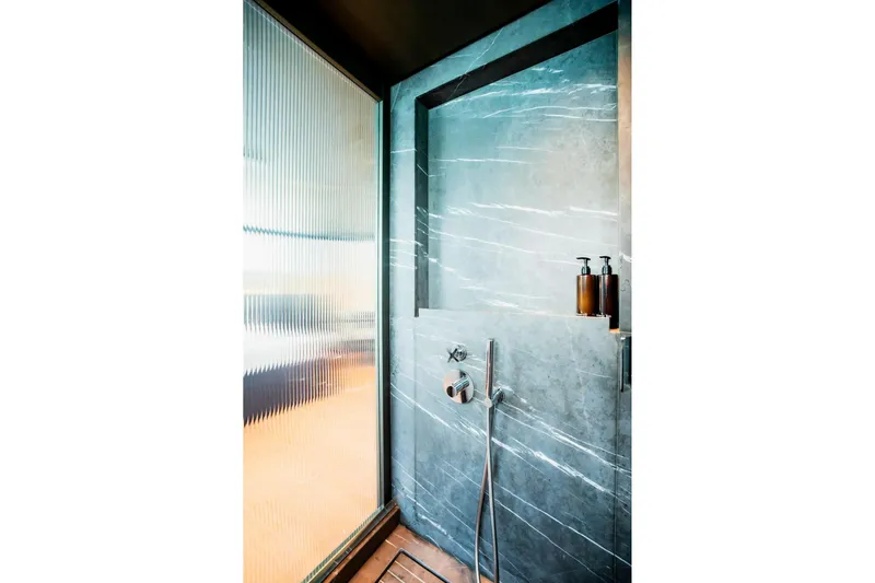  Yacht Photos Pics Luxurious bathroom in 2024 Sanlorenzo SX100 yacht with modern shower design.