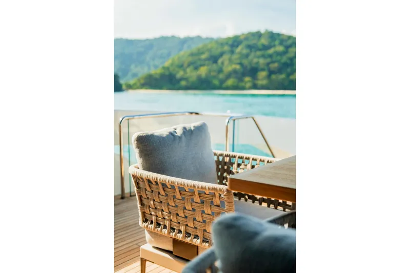  Yacht Photos Pics Luxury seating on 2024 Sanlorenzo SX100 yacht with scenic ocean view.