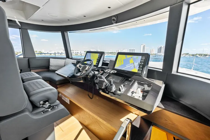 Fantasy Girl Yacht Photos Pics Luxurious helm of 2025 Absolute 75 Navetta yacht with advanced navigation systems.