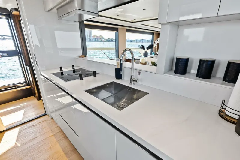 Fantasy Girl Yacht Photos Pics Modern kitchen interior on 2025 Absolute 75 Navetta yacht with sleek design and ocean view.
