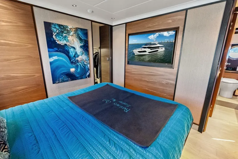 Fantasy Girl Yacht Photos Pics Luxurious bedroom interior of 2025 Absolute 75 Navetta yacht with modern decor.