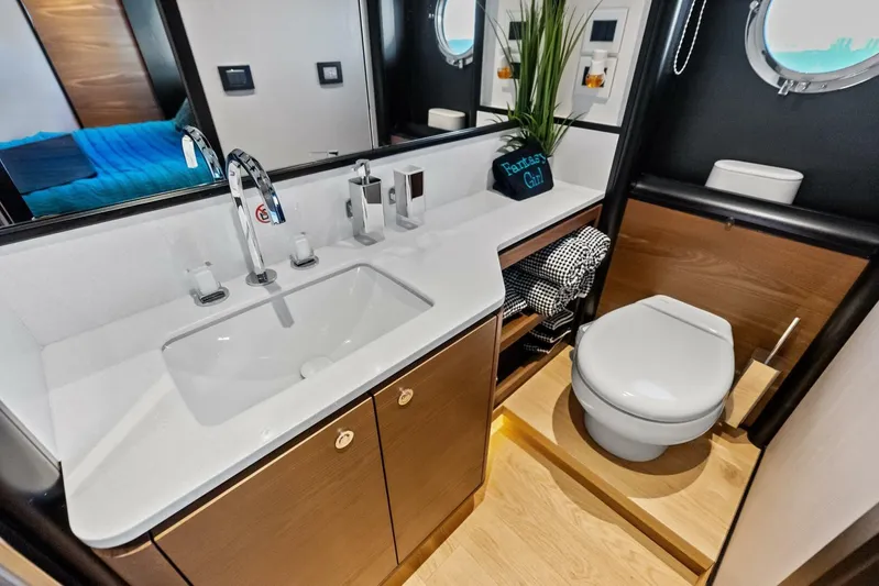 Fantasy Girl Yacht Photos Pics Luxurious bathroom in 2025 Absolute 75 Navetta yacht with modern fixtures and elegant design.