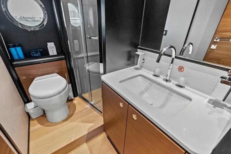 Fantasy Girl Yacht Photos Pics Luxury bathroom in 2025 Absolute 75 Navetta yacht, featuring modern fixtures and elegant design.