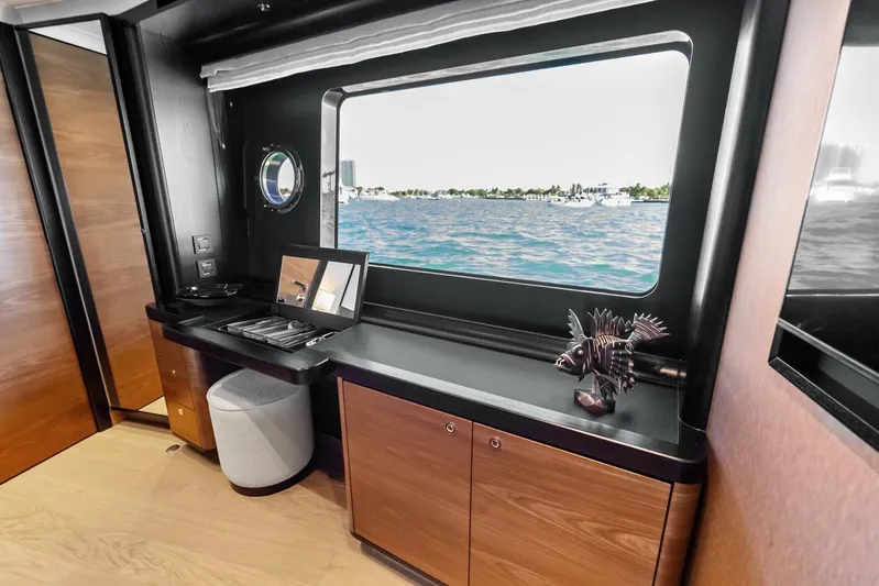 Fantasy Girl Yacht Photos Pics Luxurious interior of 2025 Absolute 75 Navetta yacht with ocean view window.