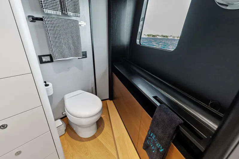 Fantasy Girl Yacht Photos Pics Luxurious bathroom interior on 2025 Absolute 75 Navetta yacht with ocean view.