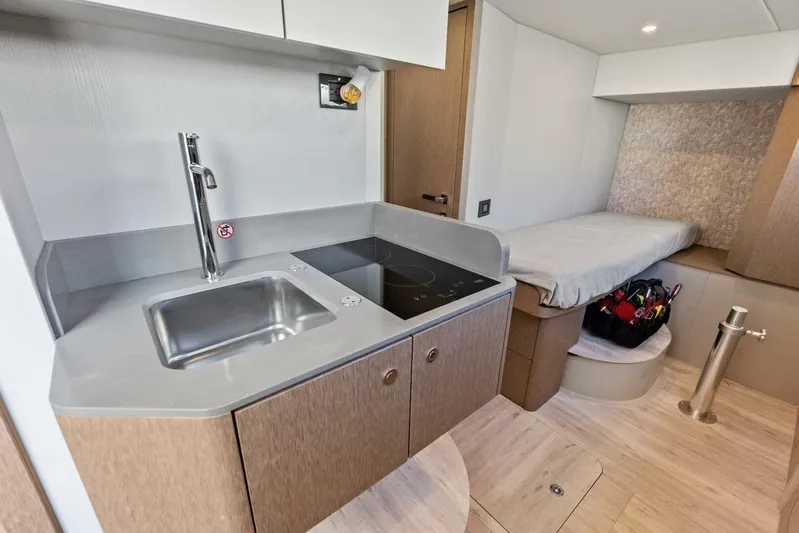 Fantasy Girl Yacht Photos Pics Modern kitchen and sleeping area in 2025 Absolute 75 Navetta yacht.