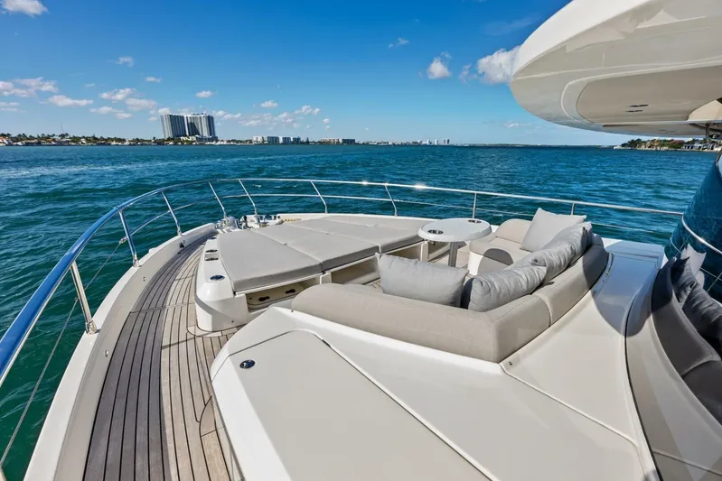 Fantasy Girl Yacht Photos Pics Luxurious 2025 Absolute 75 Navetta yacht deck with plush seating, ocean view.
