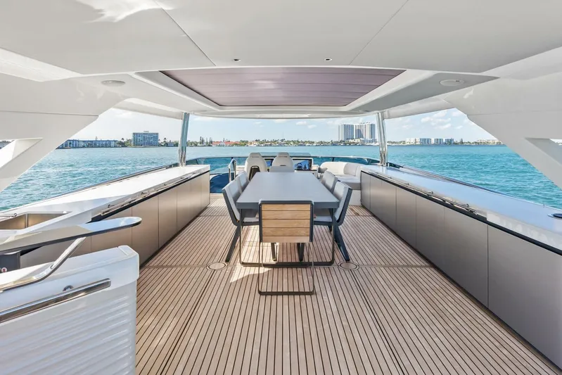 Fantasy Girl Yacht Photos Pics Luxurious 2025 Absolute 75 Navetta yacht deck with elegant seating and ocean view.
