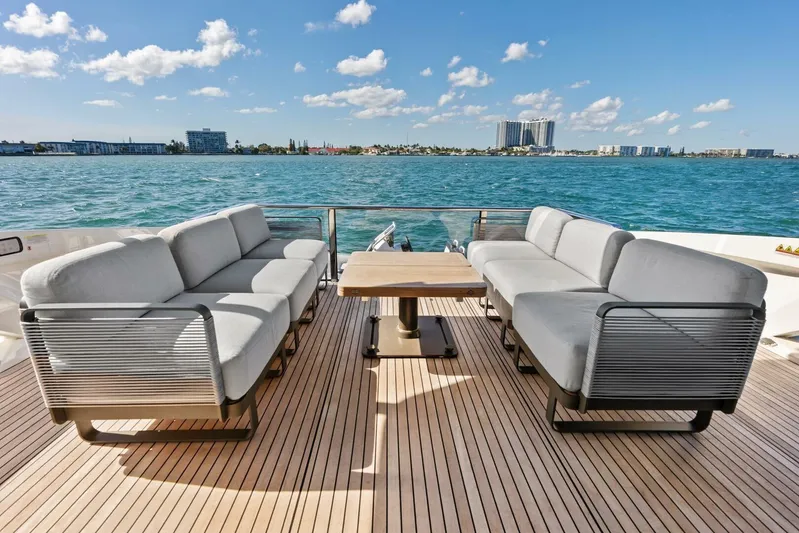 Fantasy Girl Yacht Photos Pics Luxurious deck of 2025 Absolute 75 Navetta yacht with elegant seating and ocean view.